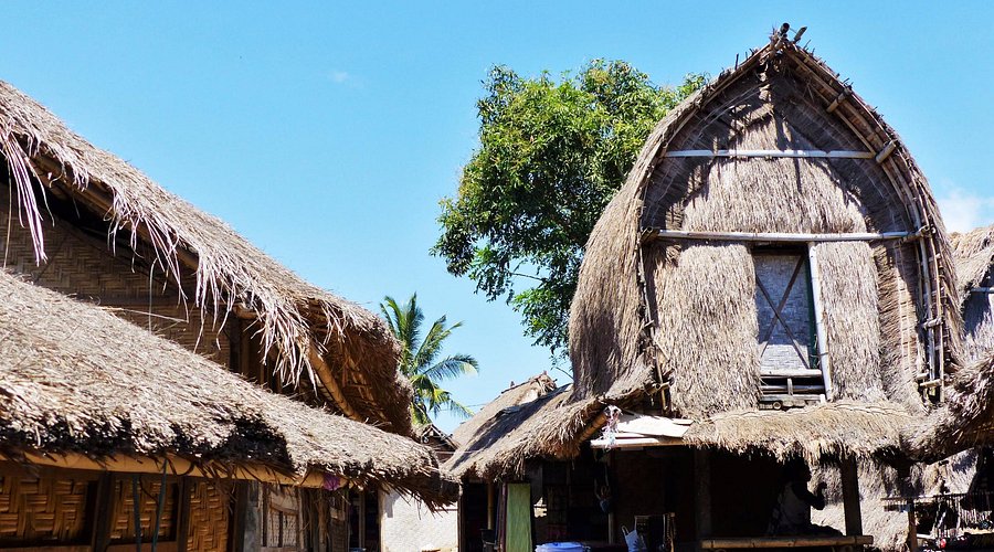Artisans creating eco-friendly woven textiles in Sukarara Village.